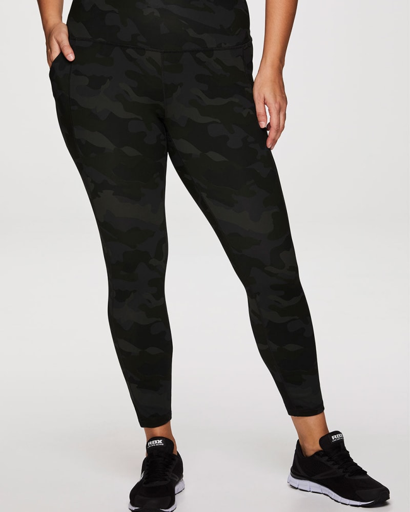 Front of a model wearing a size 1X Ultimate Camo Super Soft Legging in Green by RBX Active. | dia_product_style_image_id:244650